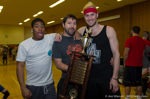 Jake Mason, flanked by two of last year's champs, holds the coveted golden cock trophy. 