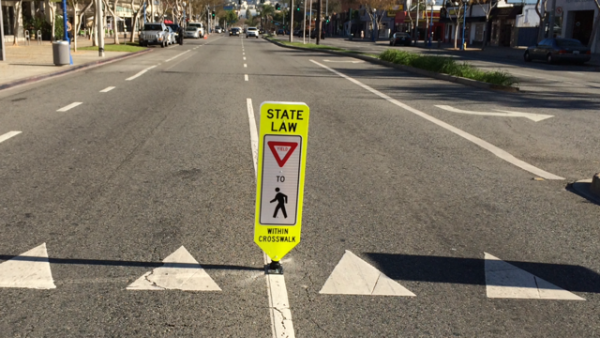 Pedestrian crosswalk warning sign on Santa Monica Boulevard at Ramage