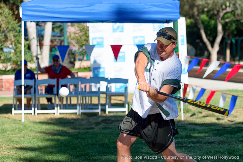 Sheriff's Det. Dave Cusiter sends that wiffle flying. (Photo by Jon Viscott, courtesy City of West Hollywood).