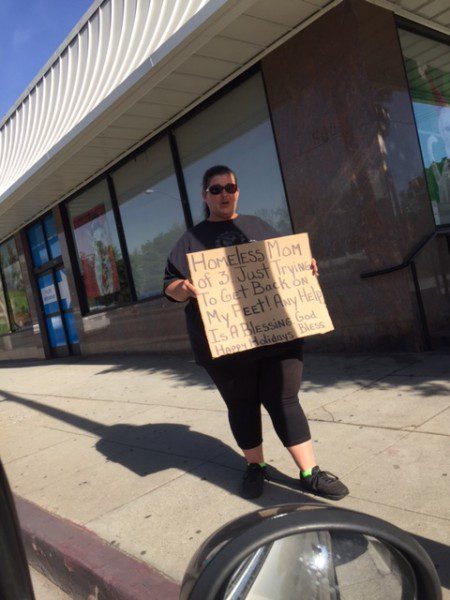 A homeless woman walking on Doheny Drive in West Hollywood.