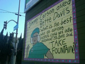A wall mural along Fountain Avenue in 2012 tells the story of Bette Davis’ appearance on “The Tonight Show” when she talked about the street. (Photo courtesy Fountain Avenue blog).